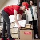 full-shot-delivery-woman-with-boxes