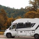 motorhome-parked-outdoors-forest-setting